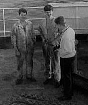 Three engineers standing on deck