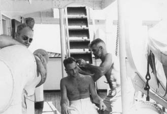 Chief Officer cutting the Captain's hair