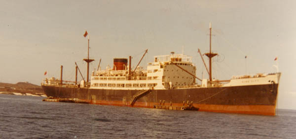 King City discharging at anchor