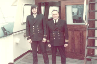 Master and third officer on bridge wing
