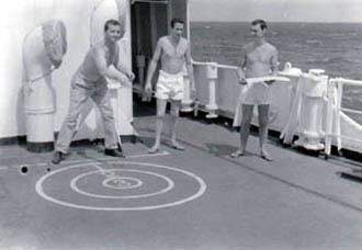 Three officers playing deck quoites