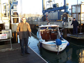 Michael Burt alongside his boat