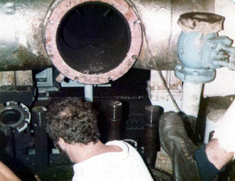 Engineer carrying out maintenance in engine room.