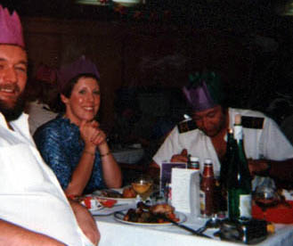 Three people having Christmas dinner