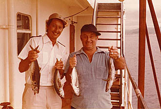 Two officers with catch of fish