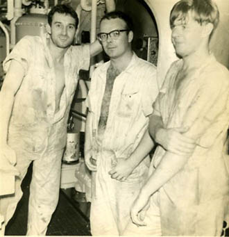 Three engineers in engine room