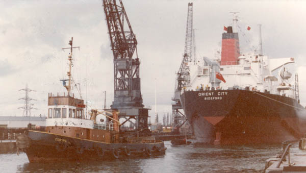 Towed astern with a tug